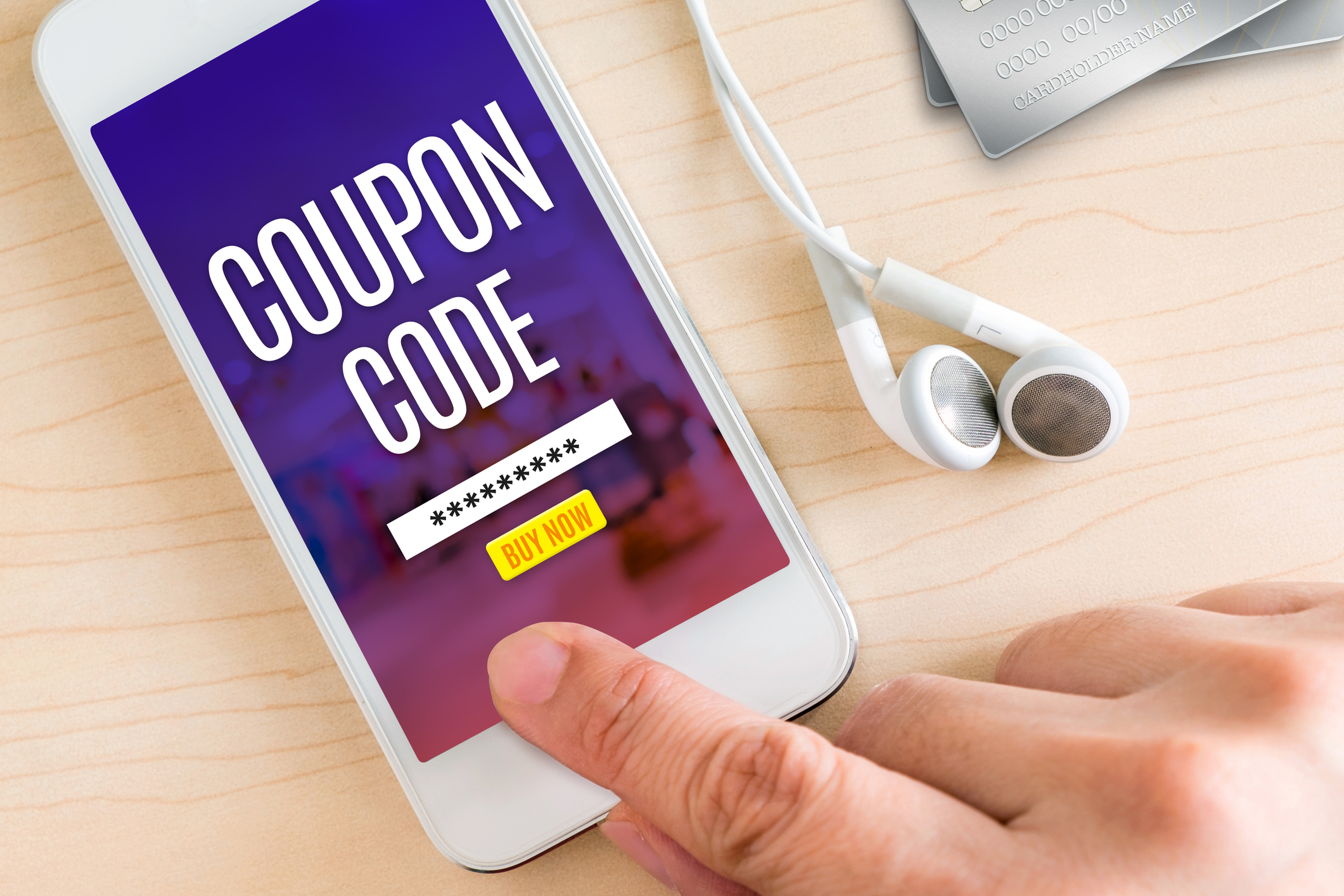 Man hand touching the phone to get coupon code online coupon