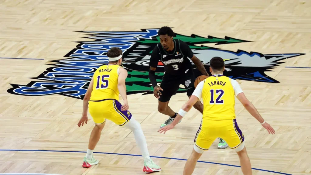 Austin Reaves hitting his game-winning fadeaway shot over Rudy Gobert